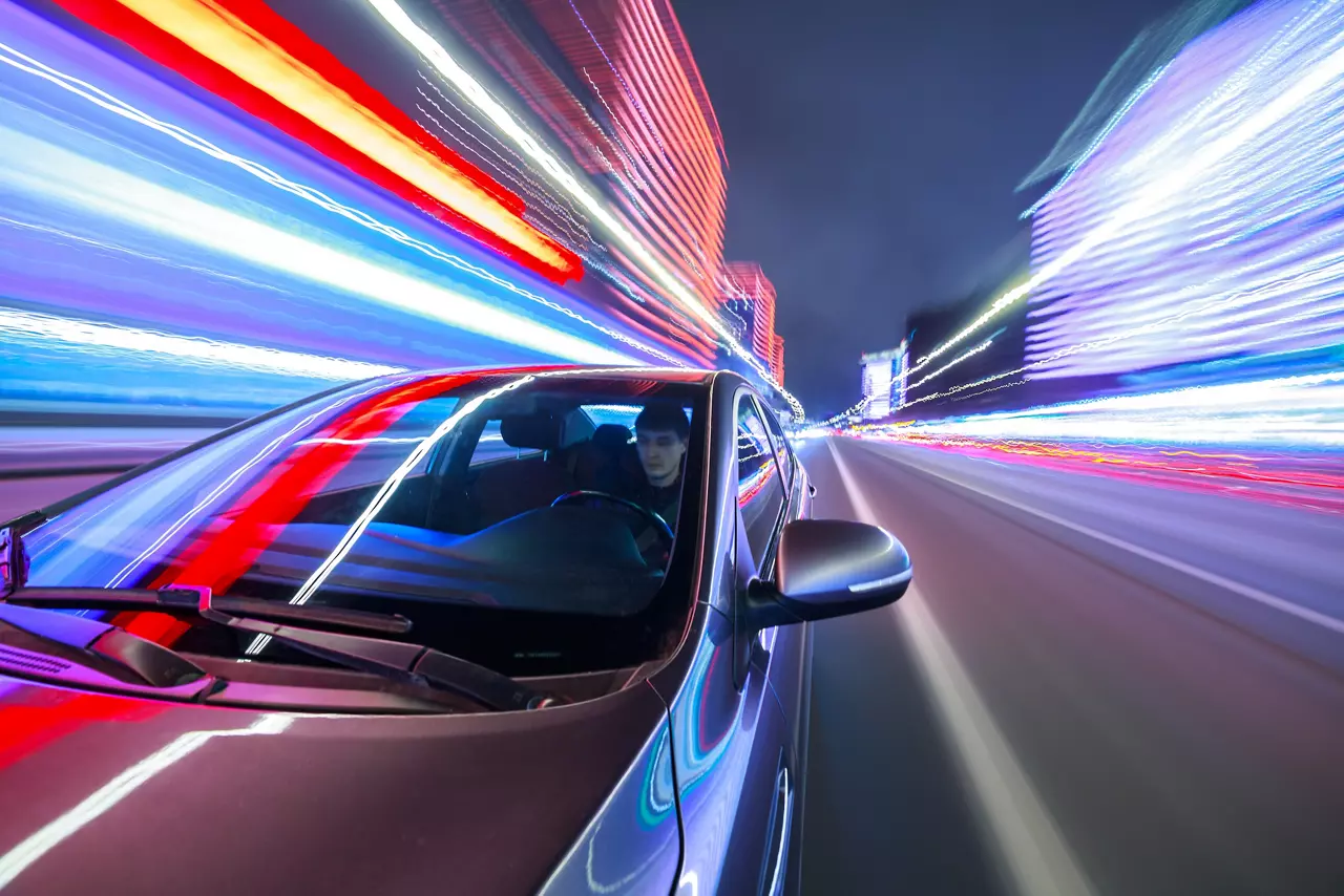 Blurred urban look from fast driving car