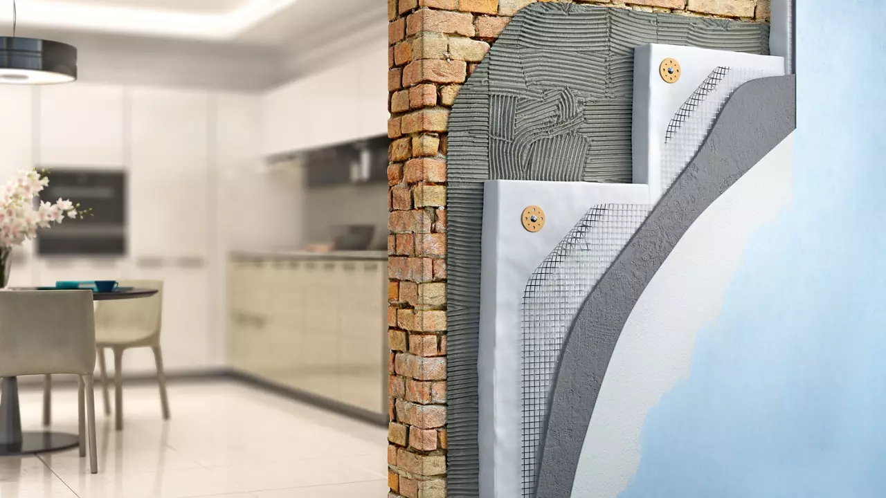 Picture of a modern kitchen with a brick wall